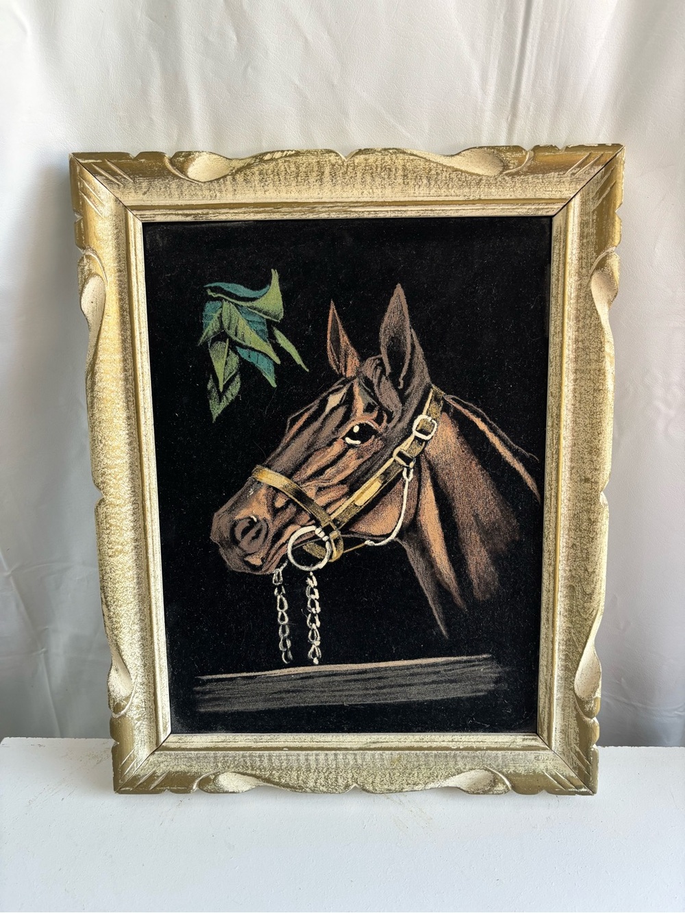 Wood framed velvet painting of a horse